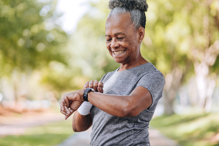 Senior woman checking the time on smartwatch