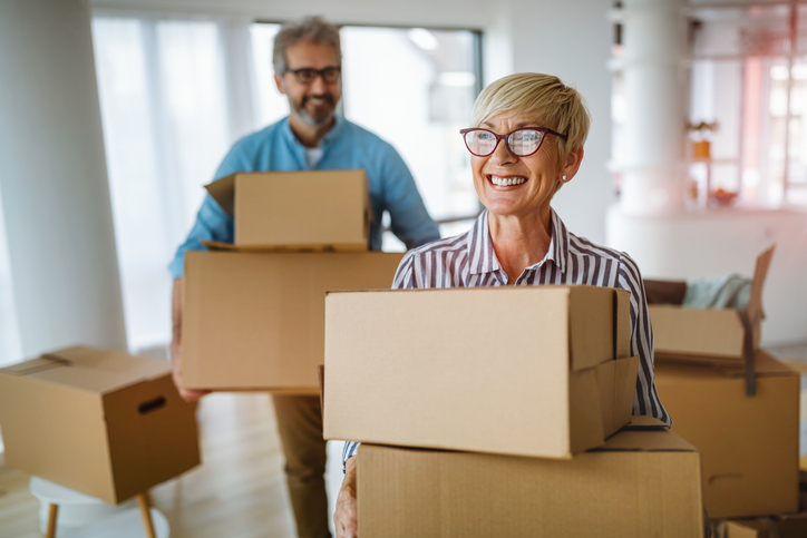 Portrait of happy smiling senior couple in love moving in new home