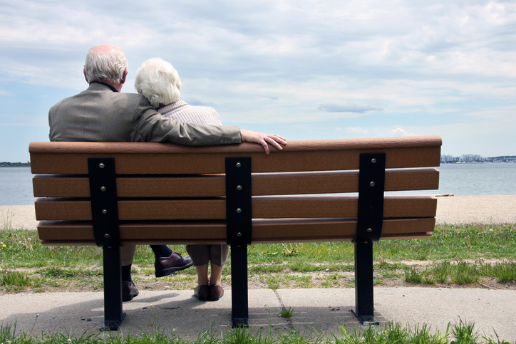 Senior couple sitting on a park bench